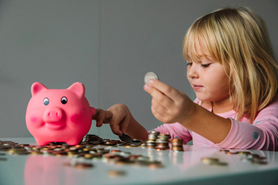 Girl with piggy bank